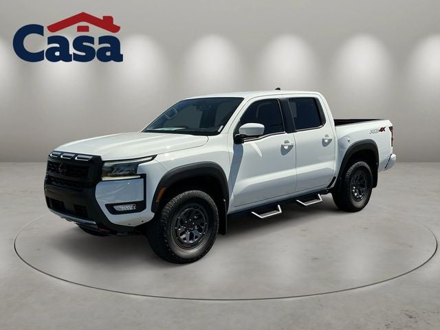 2026 Nissan Frontier PRO-4X in Glacier White — front three-quarter view