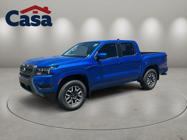 2026 Nissan Frontier SV in Bluestone Pearl — front three-quarter view