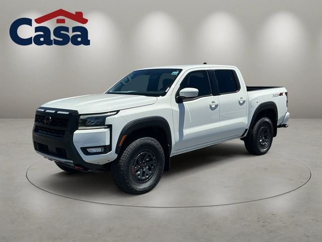 2026 Nissan Frontier PRO-4X in Glacier White — front three-quarter view