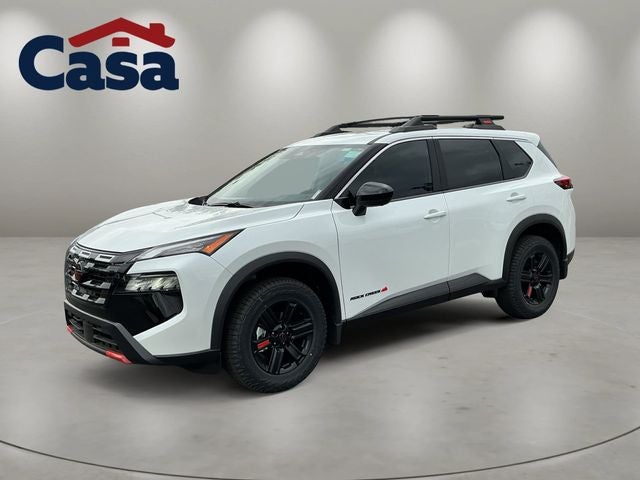 2026 Nissan Rogue Rock Creek in Everest White Pearl Tricoat — front three-quarter view